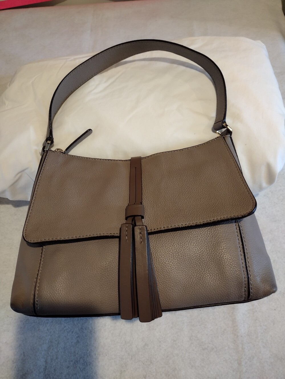 Kate Spade Taupe Pebbled Leather Shoulder Bag Featuring A Dangling Tassel